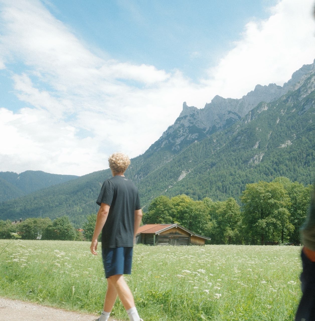 Walking a valley trail below the peaks